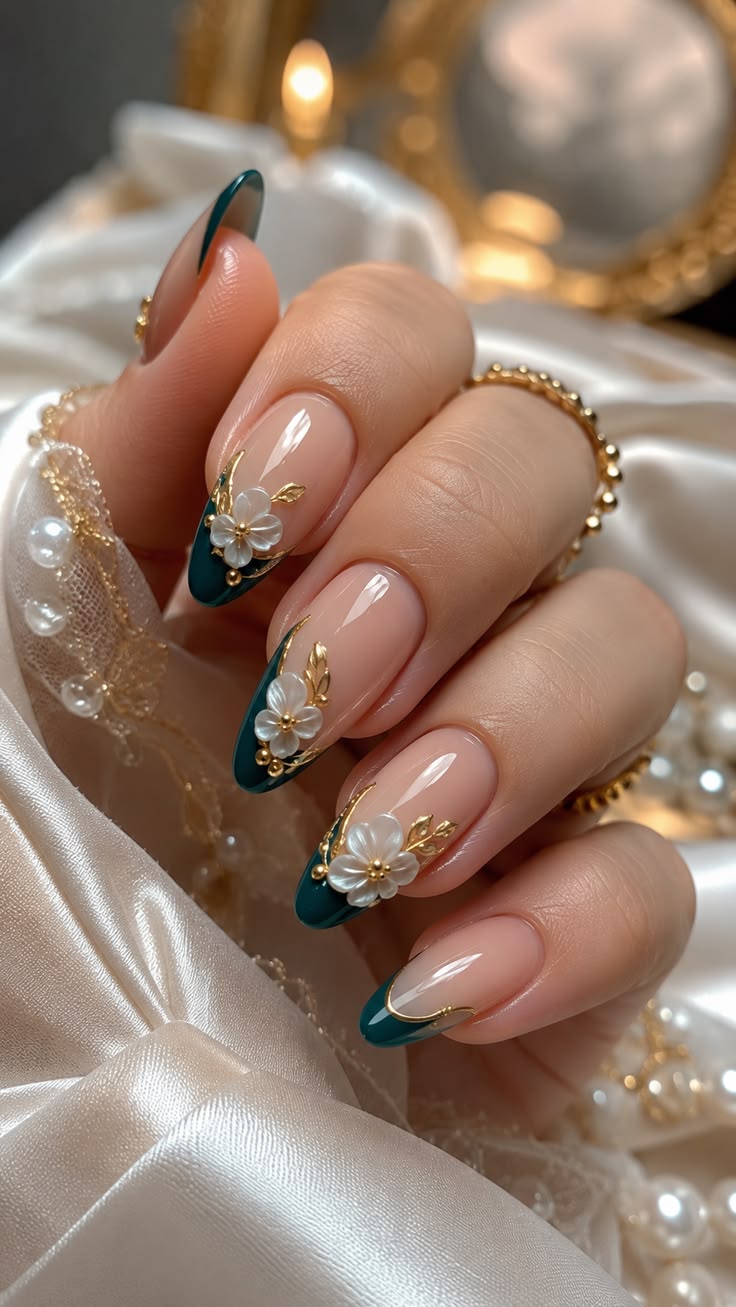 Emerald green French almond nails with 3D white flowers and gold leaf art